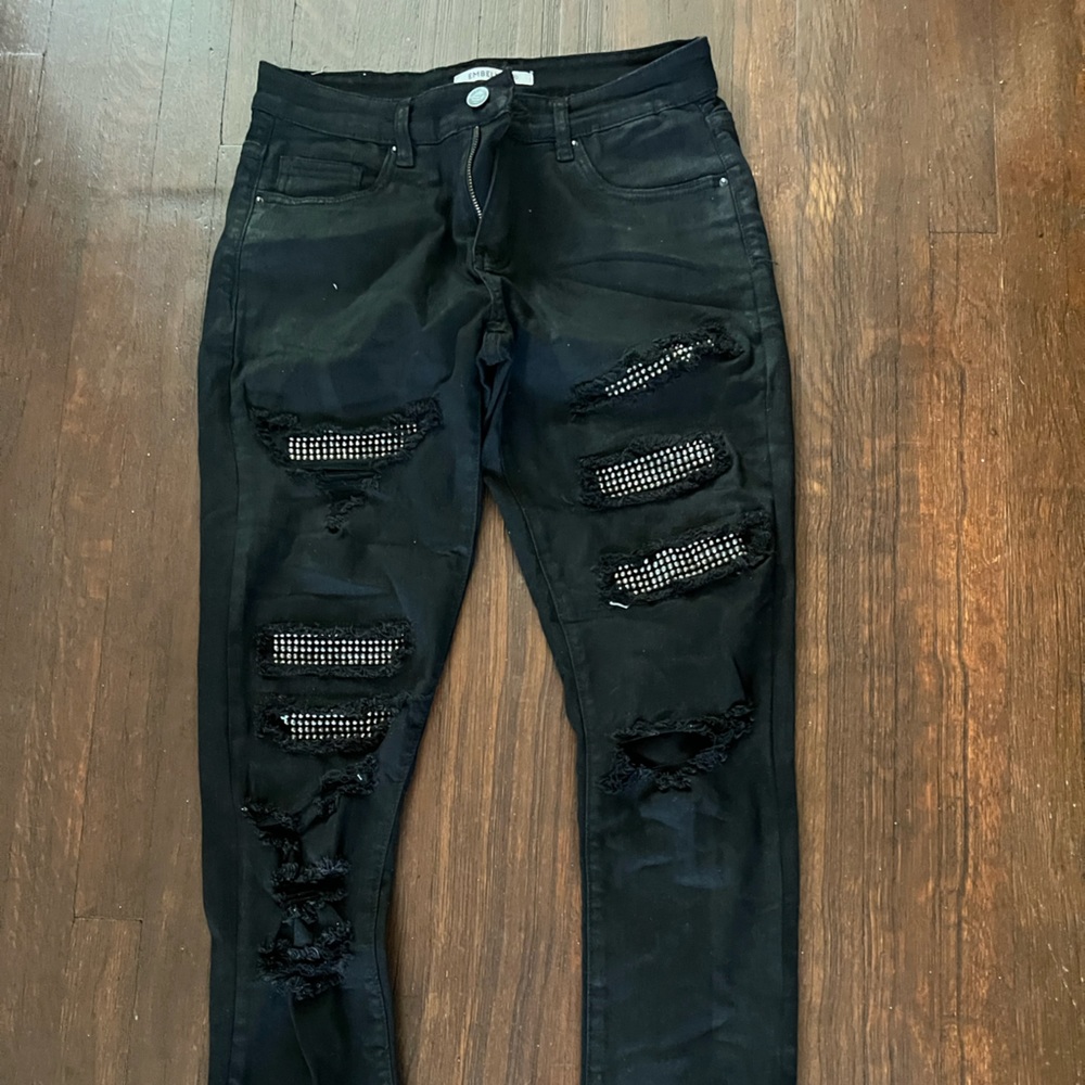Clean black pair of jeans made by Embellish